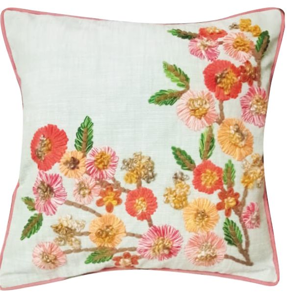 Cream cushion cover with embroidered coral and pink flowers